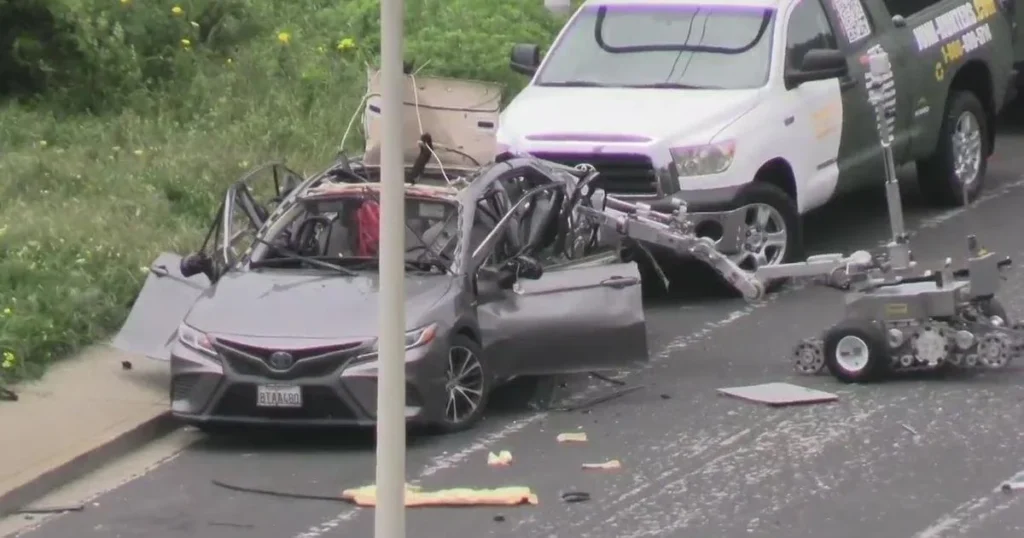 a car accident with a crane on the side of the road